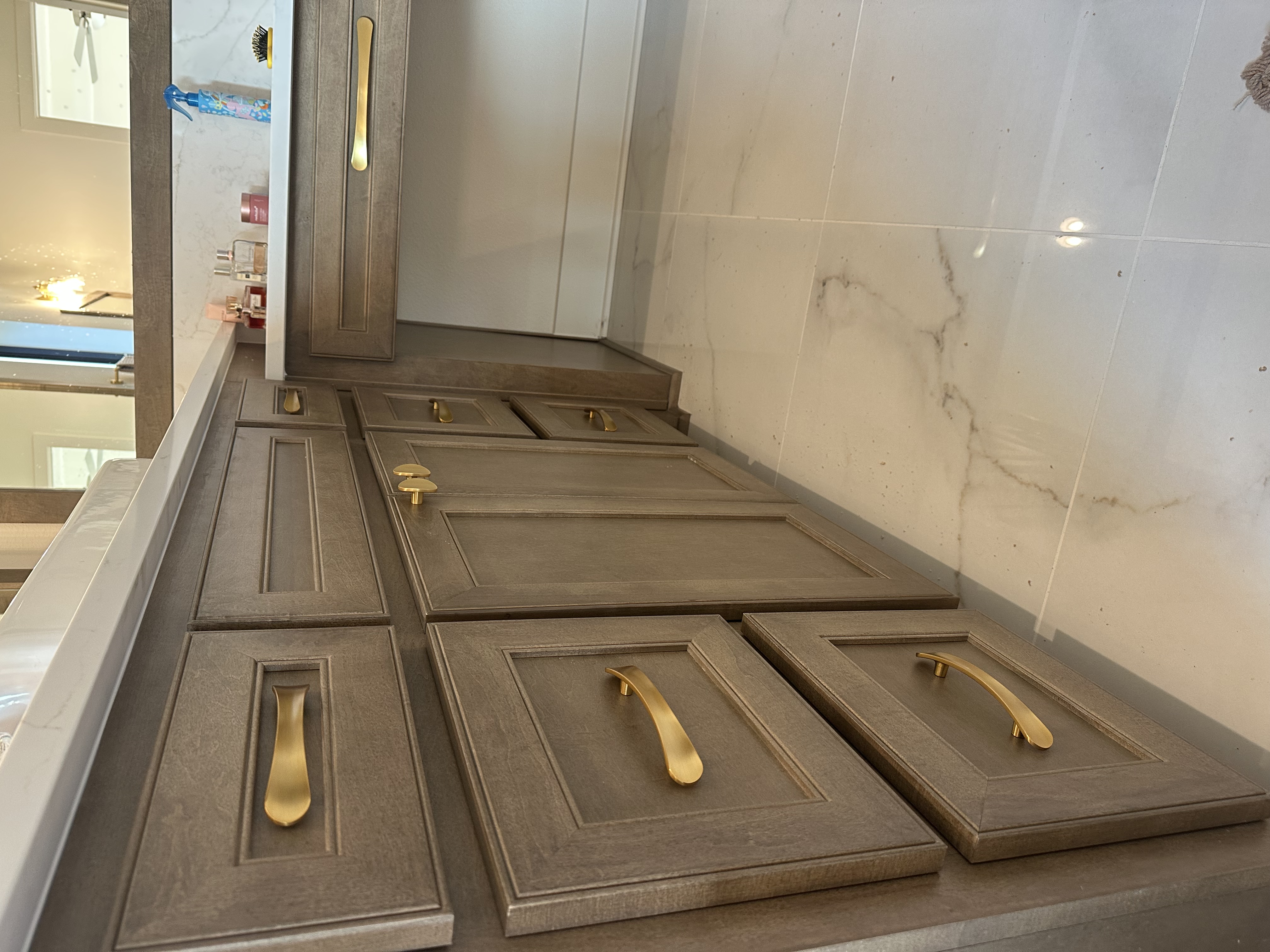 Painted cabinet doors with gold hardware