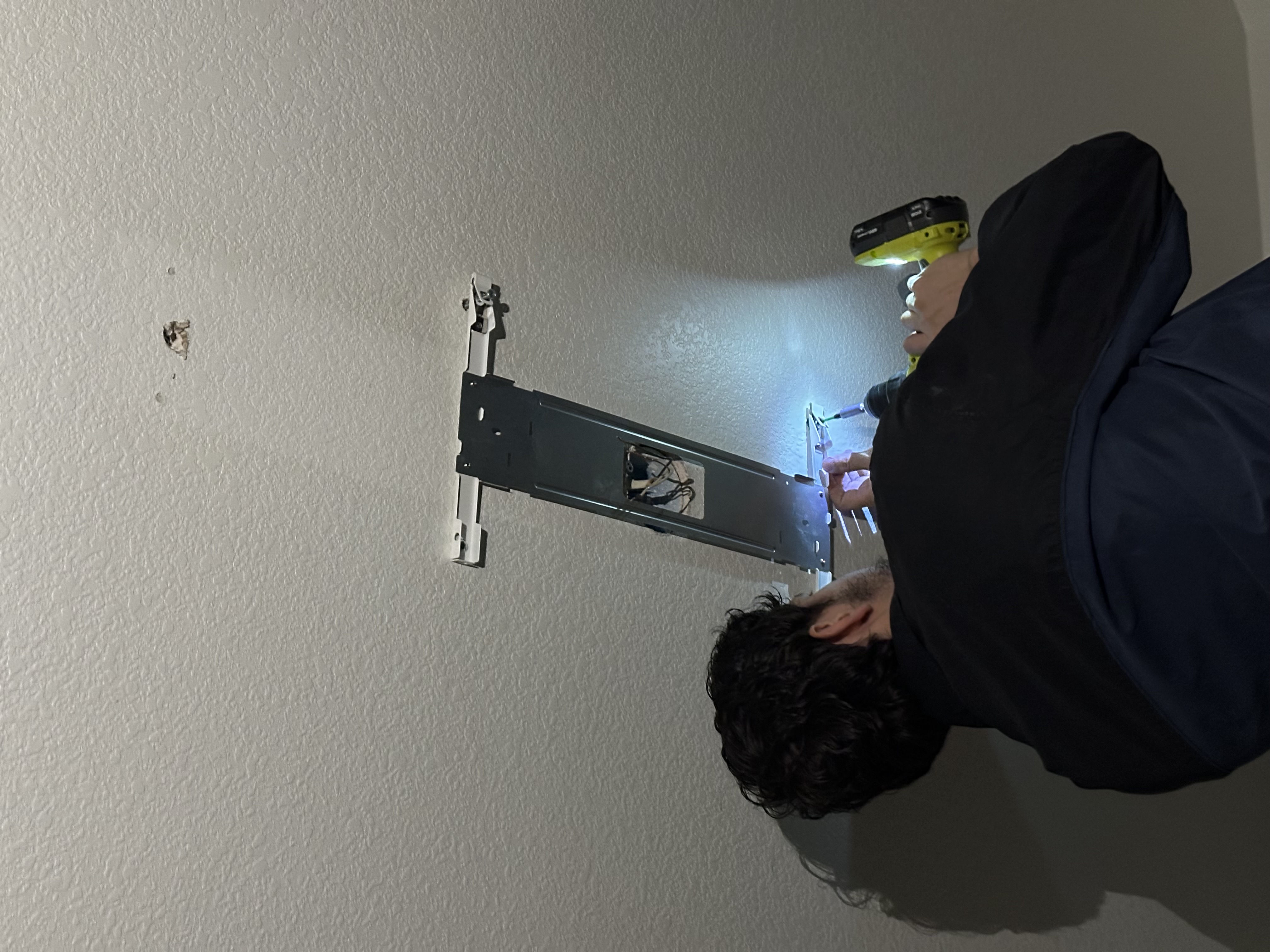 TV bracket installation in progress