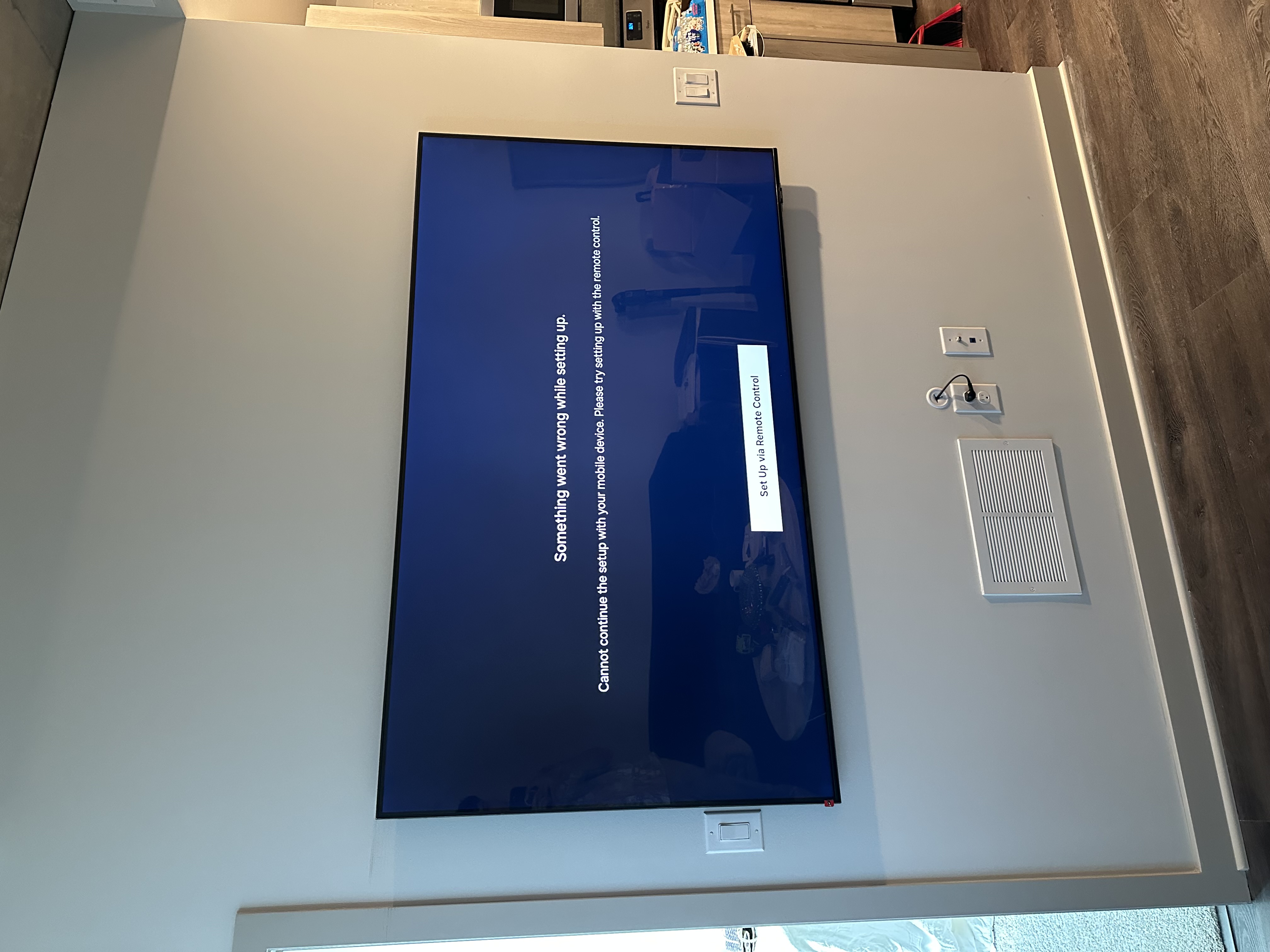 Large TV mounted on wall