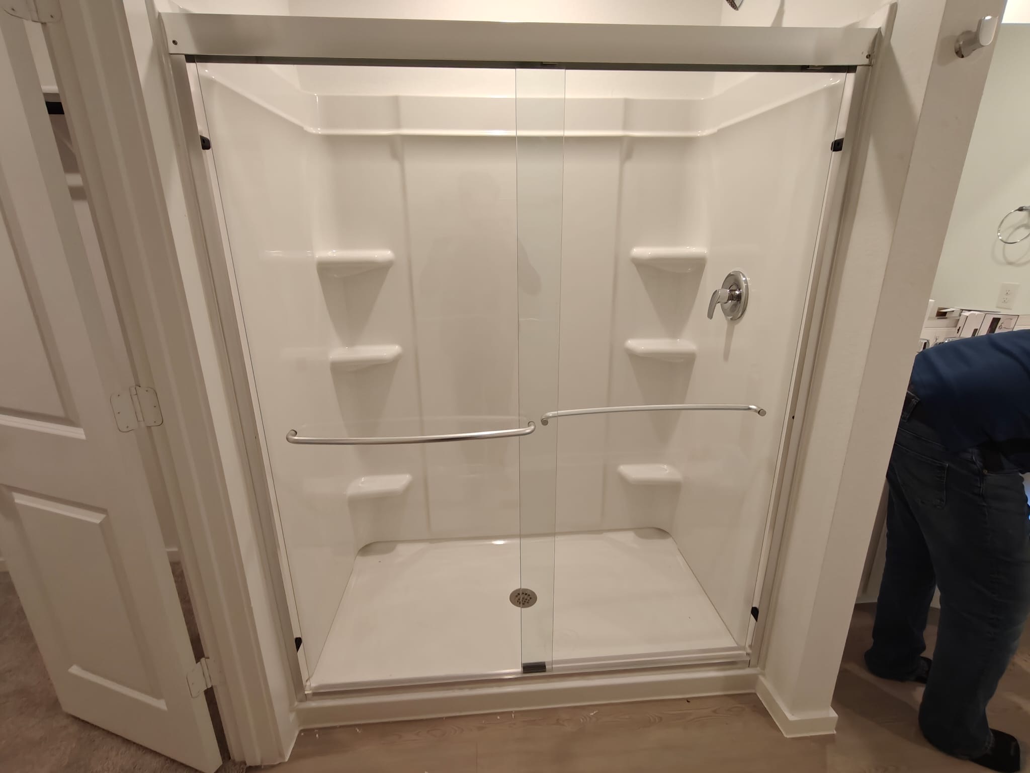 Walk-in shower with panel surround